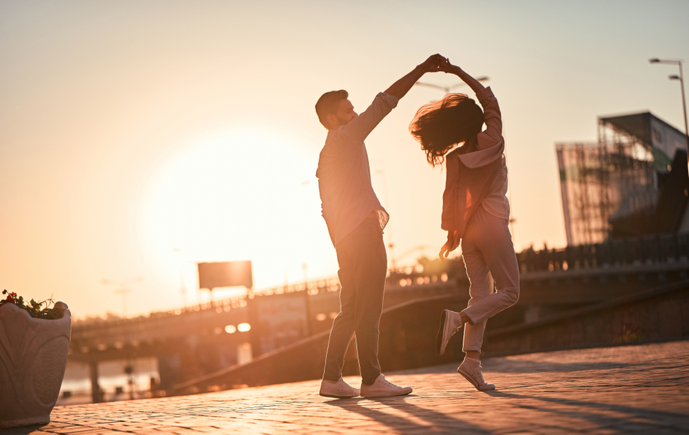 couple dancing at sunset