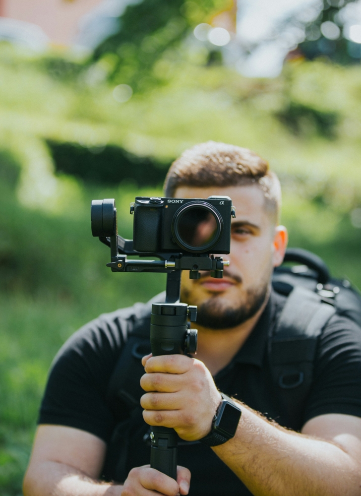 man holding a Sony a6300 on a gimble