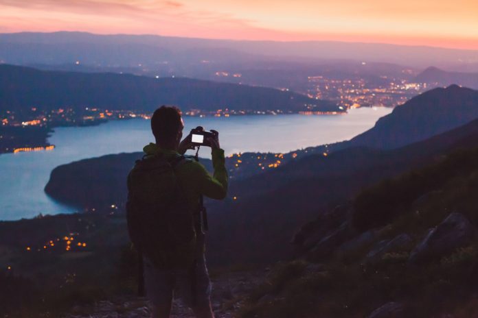 photographer taking a picture at dusk