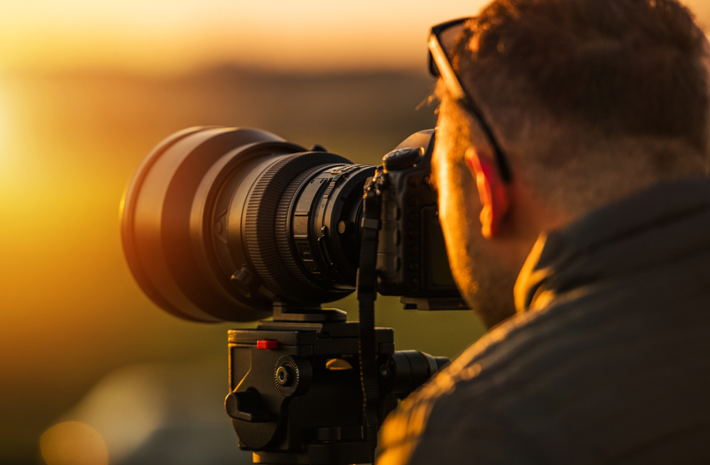 photographer with camera and lens